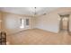 Spacious living room with tile flooring, sliding glass doors, and access to bathroom at 1813 Pluto Dr, Las Vegas, NV 89108