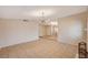 Open concept living room with tile floors, neutral walls, and modern light fixtures at 1813 Pluto Dr, Las Vegas, NV 89108