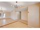 Bright open floor plan with tile floors, modern light fixtures, and access to the backyard at 1813 Pluto Dr, Las Vegas, NV 89108