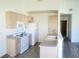 Bright kitchen with white appliances, and ample counter space at 1901 E Calvada Blvd, Pahrump, NV 89048