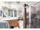 Bathroom featuring dual sinks, a soaking tub, and a glass shower at 1930 Silver Crest Ct, North Las Vegas, NV 89031