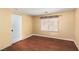 A cozy room with hardwood floors, neutral paint, and a window with curtains creates a calm, inviting atmosphere at 1930 Silver Crest Ct, North Las Vegas, NV 89031