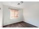 Neutral bedroom with hardwood floors and natural light from the window at 1930 Silver Crest Ct, North Las Vegas, NV 89031