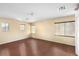 Spacious bedroom featuring wood-look floors, neutral paint, and natural light at 1930 Silver Crest Ct, North Las Vegas, NV 89031