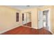 Bedroom with wood flooring, closet with sliding mirrored doors, and ample natural light at 1930 Silver Crest Ct, North Las Vegas, NV 89031