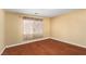 A cozy room with hardwood floors, neutral paint, and a window with curtains creates a calm, inviting atmosphere at 1930 Silver Crest Ct, North Las Vegas, NV 89031