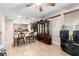 Open dining area with tile flooring, windows for natural light, and an elegant cabinet at 1930 Silver Crest Ct, North Las Vegas, NV 89031