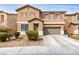 Charming two-story home features a well-maintained yard, desert landscaping, and an attached two-car garage at 1930 Silver Crest Ct, North Las Vegas, NV 89031