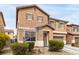 Inviting two-story home featuring a low maintenance front yard, desert landscaping, and an attached garage at 1930 Silver Crest Ct, North Las Vegas, NV 89031