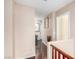 Hallway with wood floors, neutral paint, and access to multiple rooms at 1930 Silver Crest Ct, North Las Vegas, NV 89031