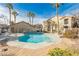Community pool with lounge chairs and clear blue water, surrounded by well-maintained landscaping at 2110 Los Feliz St # 2037, Las Vegas, NV 89156