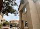 Two-story condo building with well-maintained landscaping, parking, and direct access to units at 2110 Los Feliz St # 2037, Las Vegas, NV 89156