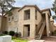 Two-story condo building featuring a private balcony, desert landscaping, and easy access to units at 2110 Los Feliz St # 2037, Las Vegas, NV 89156