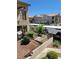 Exterior view of condo buildings with well-maintained landscaping and assigned parking at 2110 Los Feliz St # 2037, Las Vegas, NV 89156