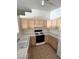 A practical kitchen features white countertops and sufficient cabinetry, ready for simple meal preparations at 2110 Los Feliz St # 2037, Las Vegas, NV 89156