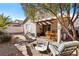 Backyard featuring a covered patio area and desert landscaping at 2137 Hidden Ranch Ter, Henderson, NV 89052