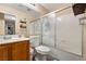 Bathroom featuring a shower-tub combo and a white toilet at 2137 Hidden Ranch Ter, Henderson, NV 89052