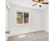 Light-filled bedroom with tiled floor, ceiling fan, and a window view of the outdoors at 2137 Hidden Ranch Ter, Henderson, NV 89052