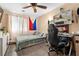 Bedroom featuring a desk with a black rolling chair and neutral colored walls at 2137 Hidden Ranch Ter, Henderson, NV 89052
