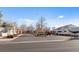 Community entrance featuring mature trees, landscaping, a gate, and signage at 2137 Hidden Ranch Ter, Henderson, NV 89052