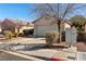 Charming single-story home with a two-car garage, well-maintained landscaping, and a welcoming entrance at 2137 Hidden Ranch Ter, Henderson, NV 89052