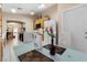 Cozy eat-in kitchen with a modern table set, wooden cabinets, and white appliances, adjacent to the living area at 2137 Hidden Ranch Ter, Henderson, NV 89052