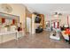 Bright, airy living room boasts tile flooring, large windows, and open layout perfect for entertaining at 2137 Hidden Ranch Ter, Henderson, NV 89052