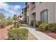 Multi-story condo building with red rock landscaping and private outdoor patios at 2305 W Horizon Ridge Pkwy # 322, Henderson, NV 89052