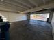 Spacious garage interior with concrete flooring and an open garage door at 233 Pecos Way, Las Vegas, NV 89121