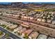 The gorgeous aerial view captures a thriving community with mature landscaping and tidy homes at 2475 Hamonah Dr, Henderson, NV 89044