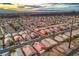 The panoramic aerial showcases a vibrant community with mountain views and city lights at 2475 Hamonah Dr, Henderson, NV 89044