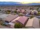 Aerial view showcasing a desert home with a covered patio, offering outdoor living space at 2475 Hamonah Dr, Henderson, NV 89044