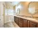 Bathroom with dual vanity, granite countertop, walk-in tub and shower at 2475 Hamonah Dr, Henderson, NV 89044
