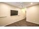 Bedroom featuring mounted TV, hardwood floors, and ceiling fan at 2475 Hamonah Dr, Henderson, NV 89044