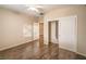 Bedroom featuring closet with sliding doors and hardwood floors at 2475 Hamonah Dr, Henderson, NV 89044