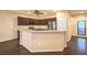 Well-equipped kitchen with granite countertops, stainless steel appliances, and breakfast bar at 2475 Hamonah Dr, Henderson, NV 89044