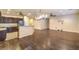 Open-concept kitchen and living area featuring hardwood floors, recessed lighting, and lots of space at 2475 Hamonah Dr, Henderson, NV 89044