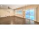 Bright open-concept living room area with hardwood floors, recessed lighting, and shuttered windows at 2475 Hamonah Dr, Henderson, NV 89044