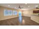 Open-concept living room featuring hardwood floors, recessed lighting, and sliding glass doors to the backyard at 2475 Hamonah Dr, Henderson, NV 89044