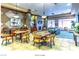 A lounge area features comfortable seating, a tv, and a kitchenette, offering a relaxing common space at 2475 Hamonah Dr, Henderson, NV 89044
