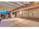An outdoor patio with a pergola covering and large concrete pavers offers a relaxing backyard space at 2475 Hamonah Dr, Henderson, NV 89044