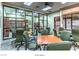 Inviting social spaces with tables, chairs, and glass-enclosed libraries for community gatherings and activities at 2475 Hamonah Dr, Henderson, NV 89044