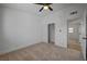 Bedroom with neutral carpet, closet, and entrance to another room at 2512 Taylor Ave, North Las Vegas, NV 89030