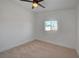 Spare bedroom with neutral carpet, ceiling fan, and window at 2512 Taylor Ave, North Las Vegas, NV 89030