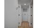 Hallway featuring hardwood flooring and white trim at 2512 Taylor Ave, North Las Vegas, NV 89030