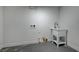 Laundry room featuring a utility sink, concrete floor, and washer/dryer hookups at 2512 Taylor Ave, North Las Vegas, NV 89030