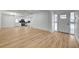 Bright and airy living space with wood-look floors and view to the kitchen at 2512 Taylor Ave, North Las Vegas, NV 89030