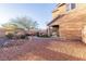 Expansive backyard featuring desert landscaping, a small patch of artificial grass, and patio at 2681 Benton Cove St, Laughlin, NV 89029