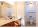 Bathroom featuring tile floors, vanity with sink and shower tub with white shower curtain at 2681 Benton Cove St, Laughlin, NV 89029