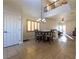 Inviting dining area boasts natural light, tile flooring, and access to the living room at 2681 Benton Cove St, Laughlin, NV 89029